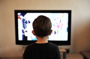 Child in front of screen