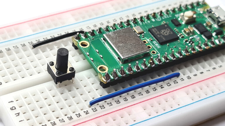 Pi Pico on breadboard with a reset button